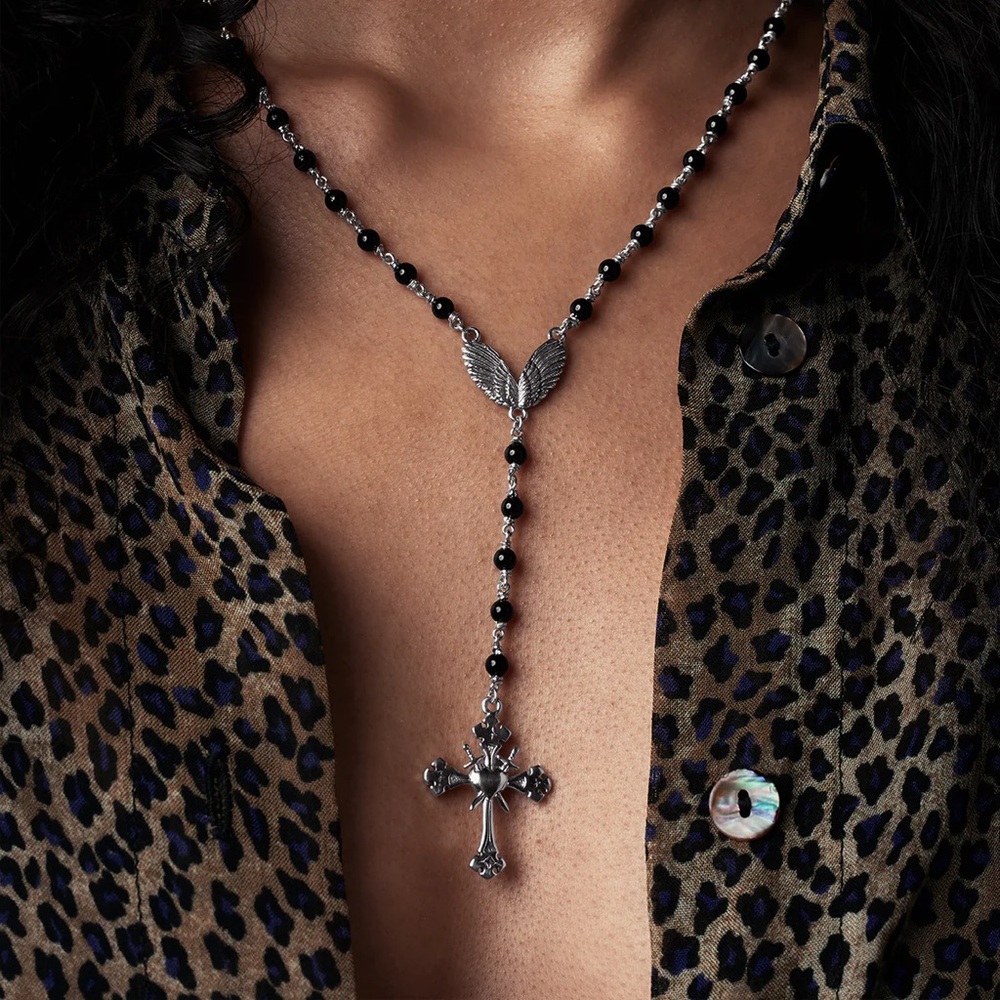 Etah Love
DEFYING STARS Elegant Silver and Black Cross Necklace